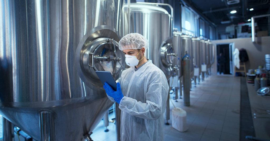 What are the benefits when companies are outsourcing their food manufacturing?